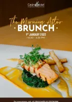 A serene hotel dining area, with empty plates and coffee cups, reflecting the calm after a lively brunch gathering.